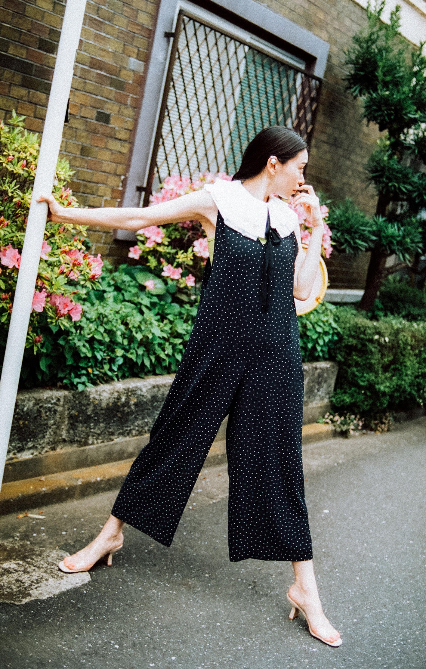 Overalls with decorative back strap