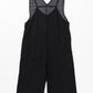 Overalls with decorative back strap